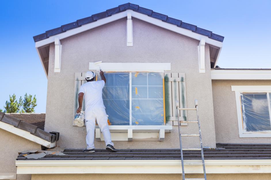Man painting exterior of house. Why do you need to paint the exterior of your home? Heres the top pro tips as to why you should.